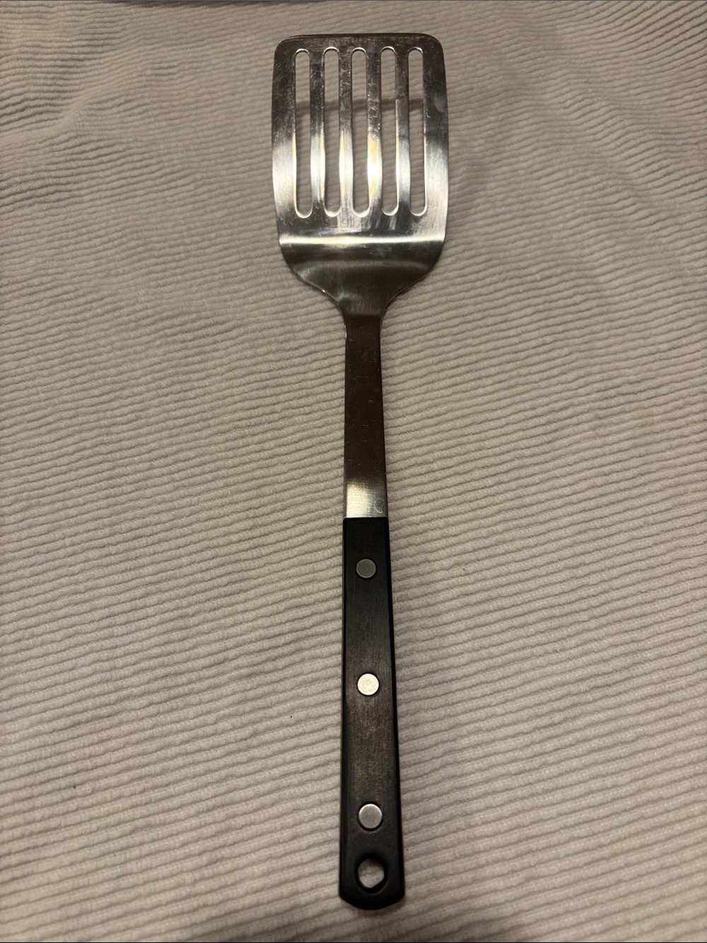 Martha Stewart Stainless Steel Slotted Spatula with Black Handle